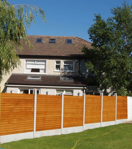 Dip Treated Overlap in Concrete Posts and Gravel Boards